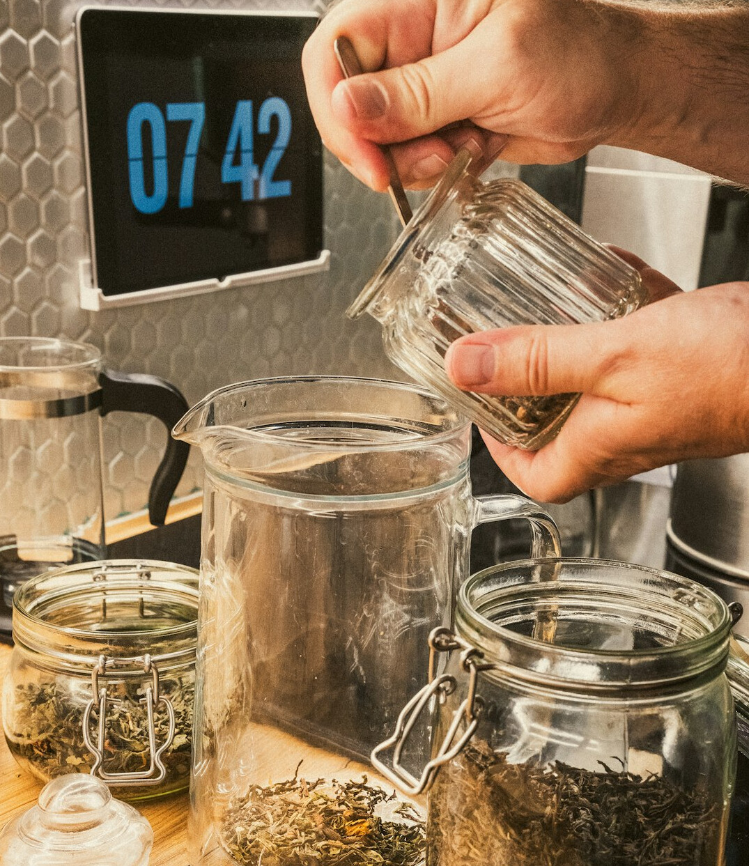 person saving money in jar