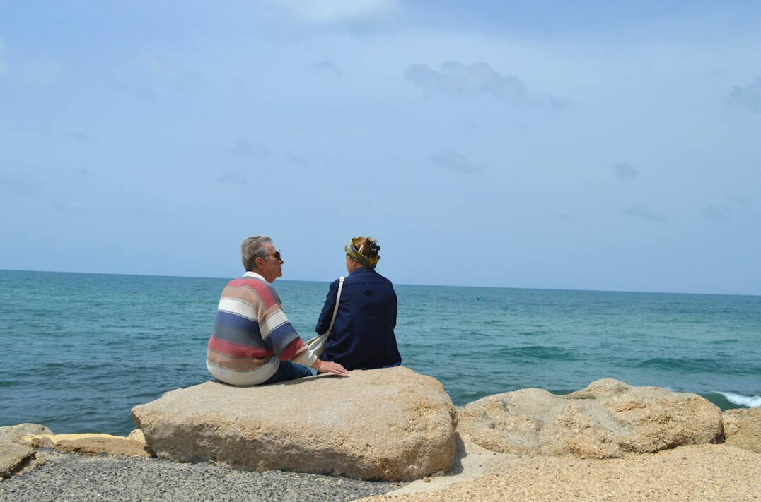 retired couple on beach