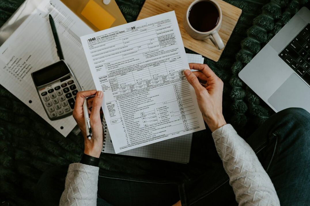 person reviewing bills at desk
