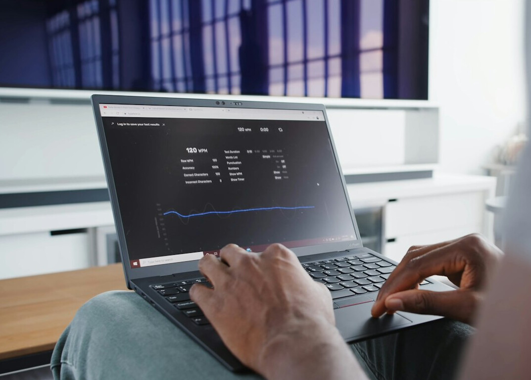 person tracking budget on laptop