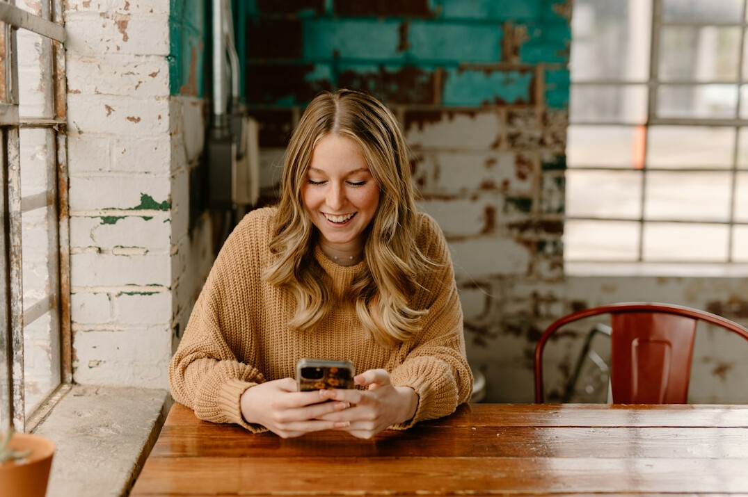 woman checking finances on phone