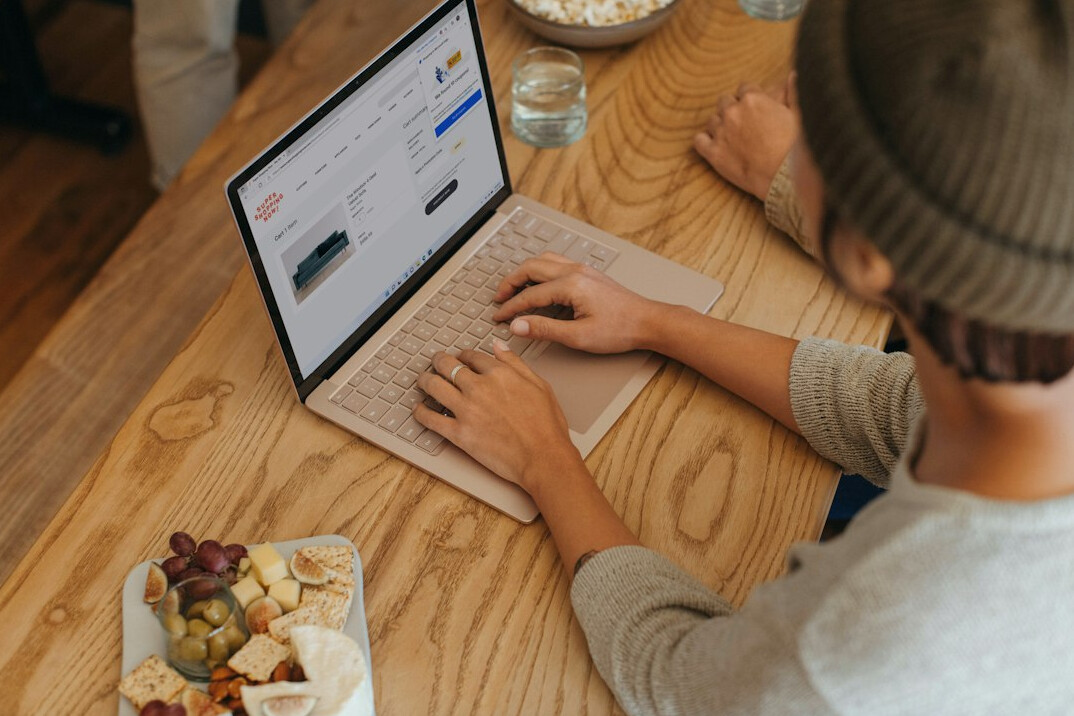 person reviewing budget on laptop