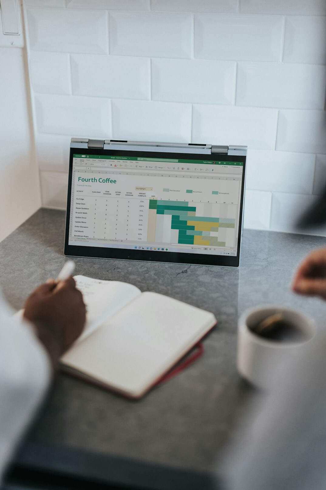 person reviewing budget on laptop