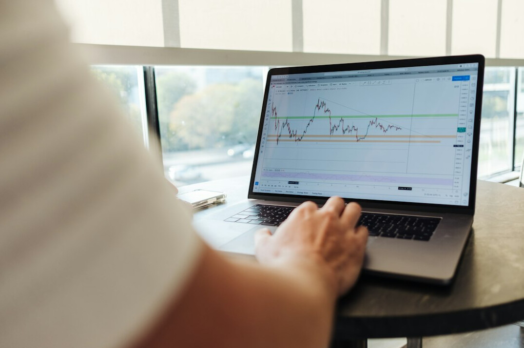 person tracking budget on laptop