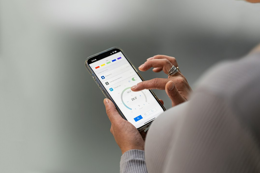 person using financial app on phone